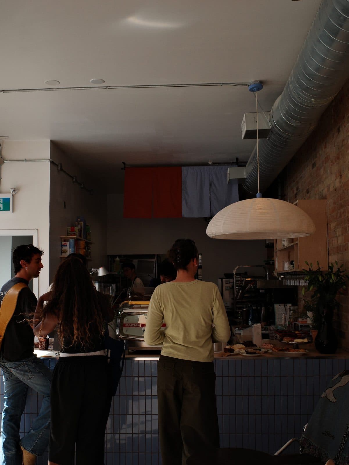 Guests at the Calmo cafe counter